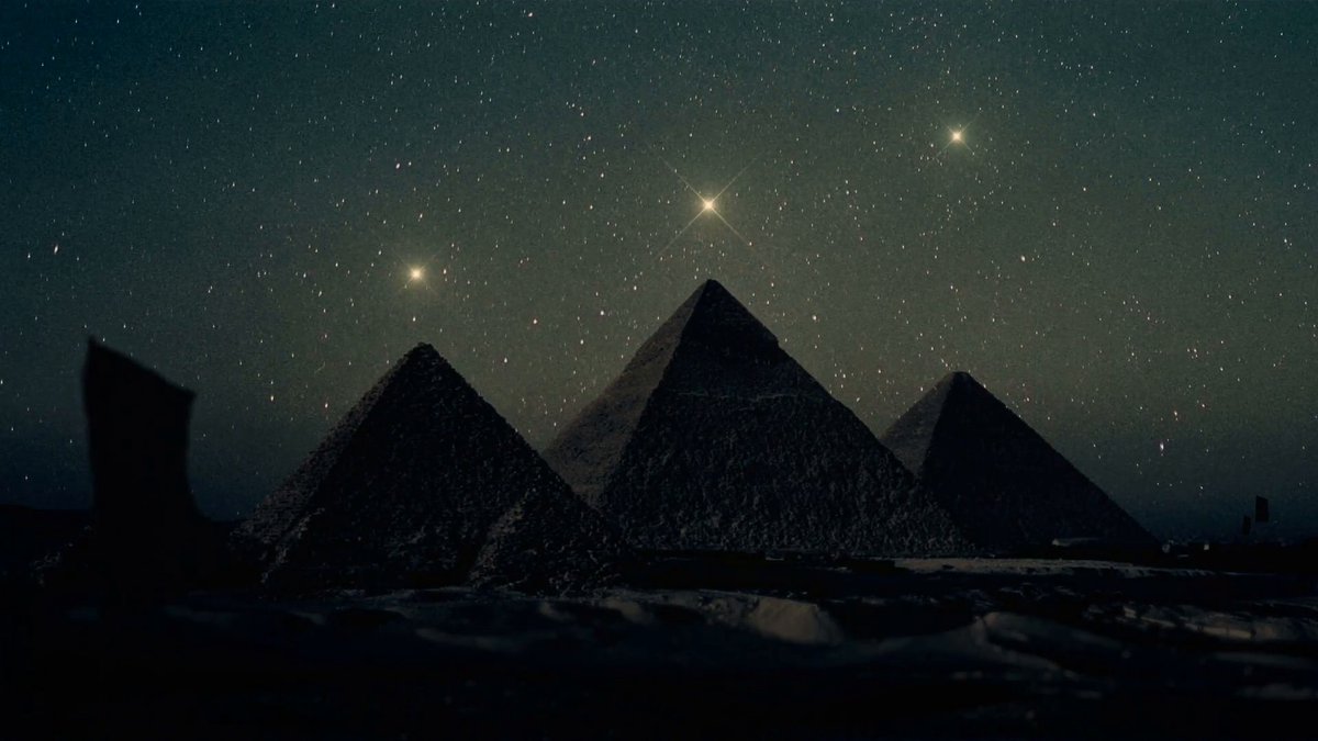 The pyramids of Giza under the night sky — Orion's Belt