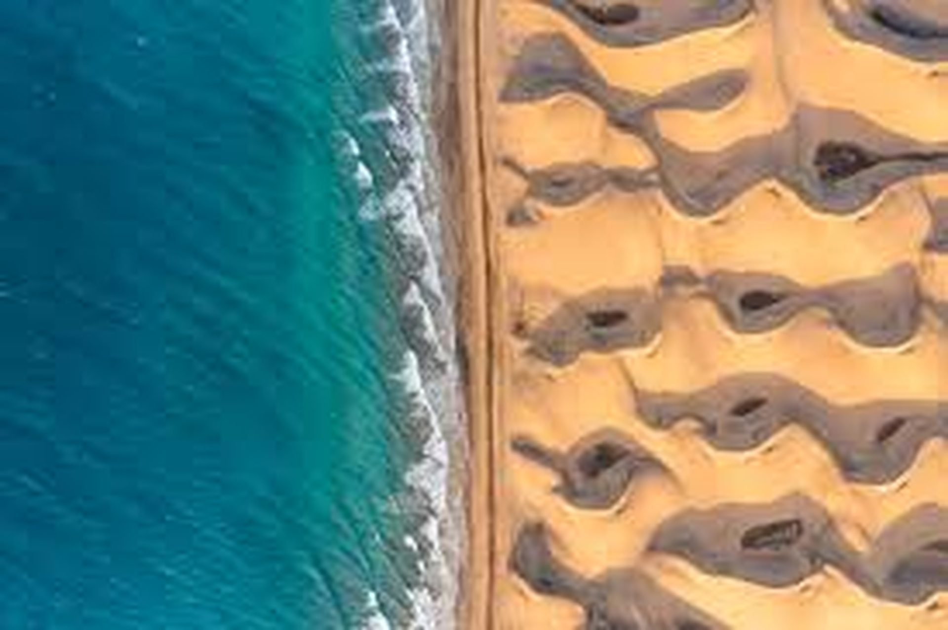 Sahara desert meets the Atlantic ocean — aerial view near Dakhla Morocco