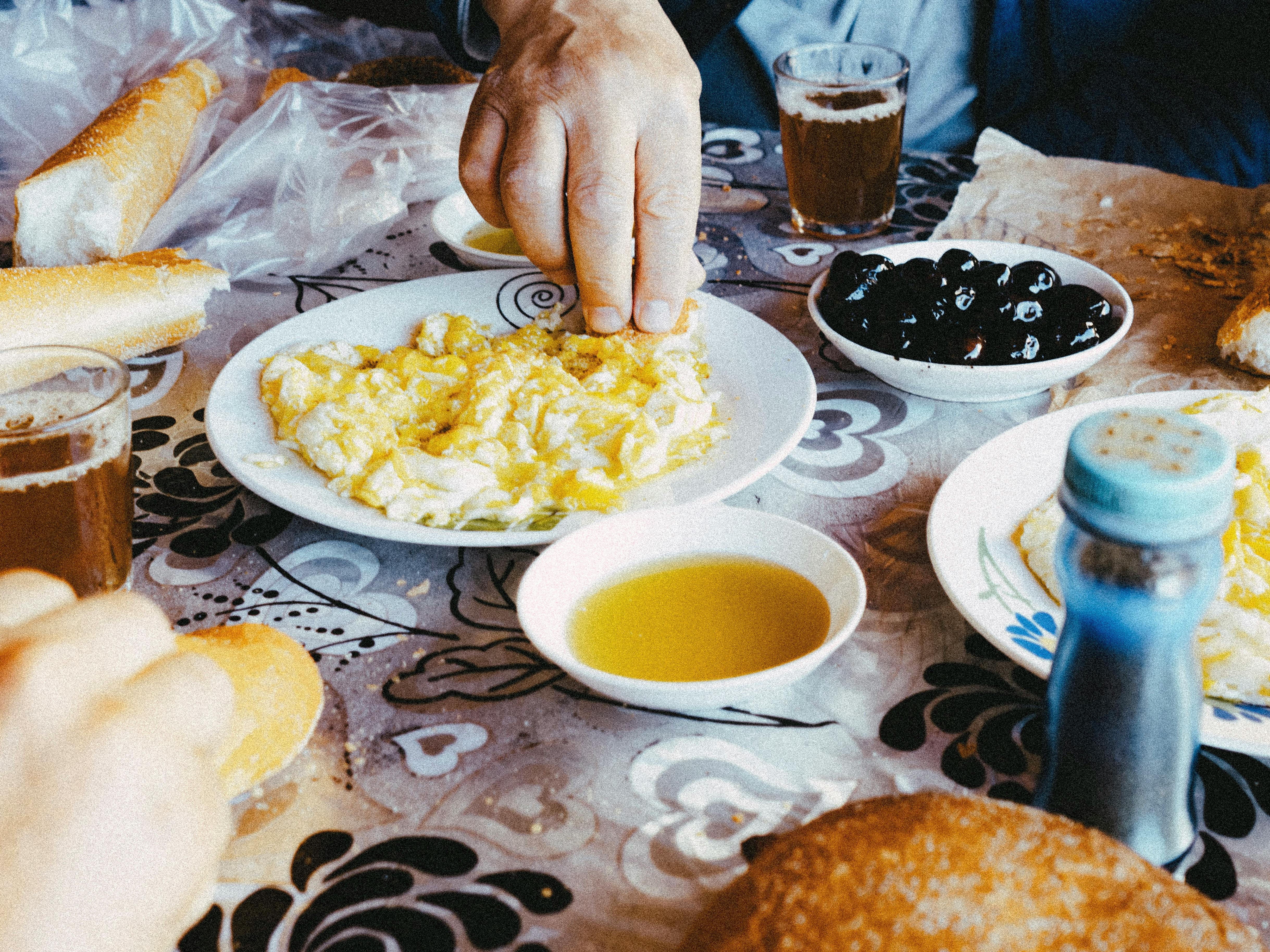 Traditional Moroccan breakfast spread with msemen, argan oil, honey and mint tea